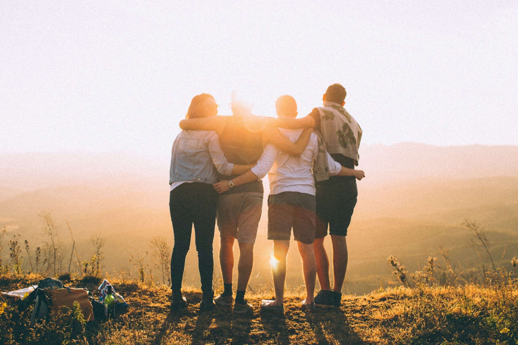 friends looking at a sunset