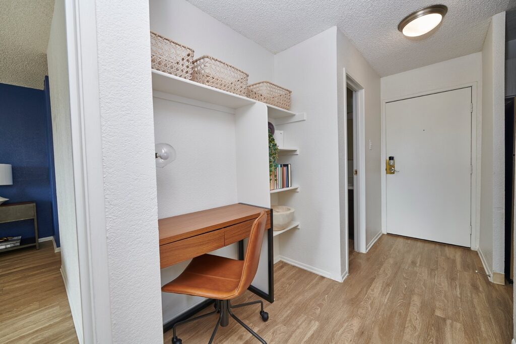 Hallway with built in desk and shelves